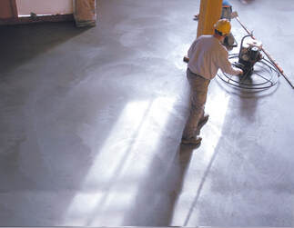 male worker polishing the flooring